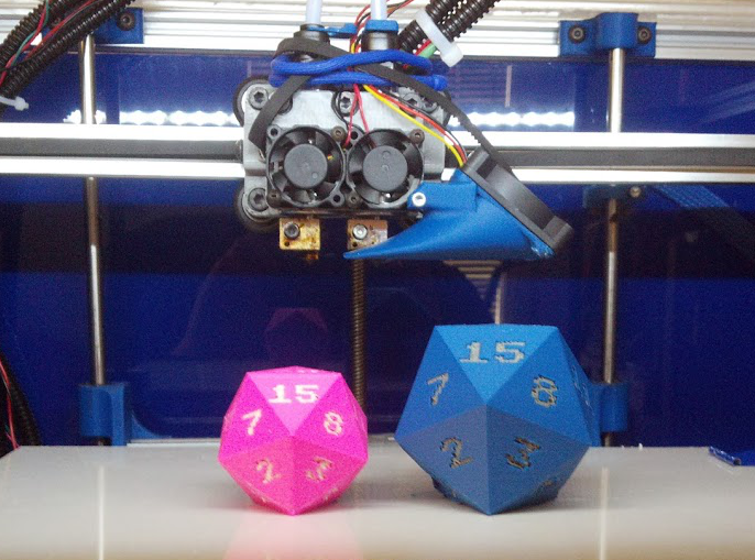Left pink PLA with white PLA numbers Right blue ABS with grey ABS numbers d20 by PuppyKhan thing28681