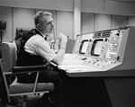 Eugene F. Kranz at his console at the NASA Mission Control Center.jpg
