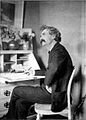 Mark Twain pondering at desk.jpg